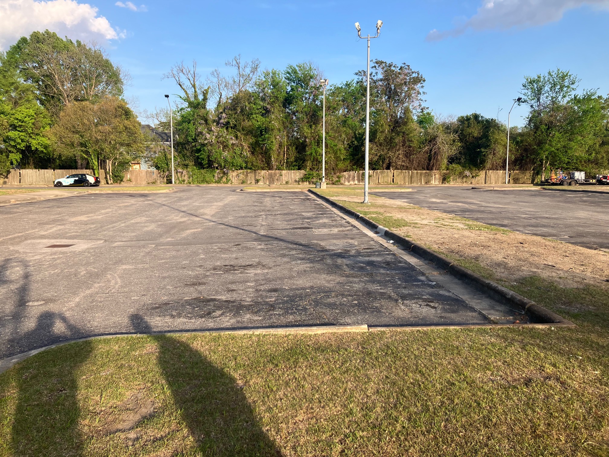 Worn parking lot before maintenance in Greensboro NC