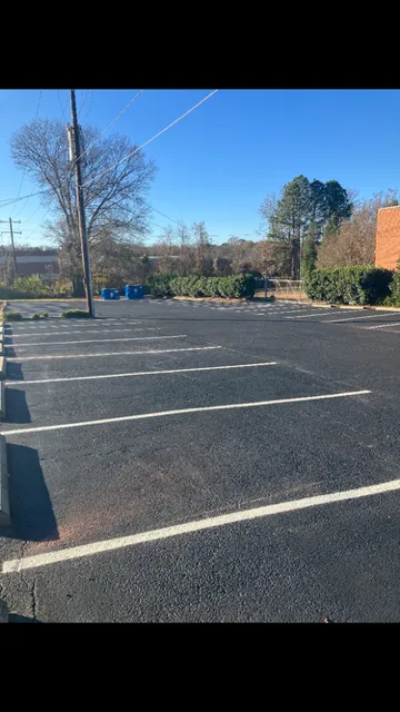 Bright new parking lot striping with ADA markings in Greensboro NC